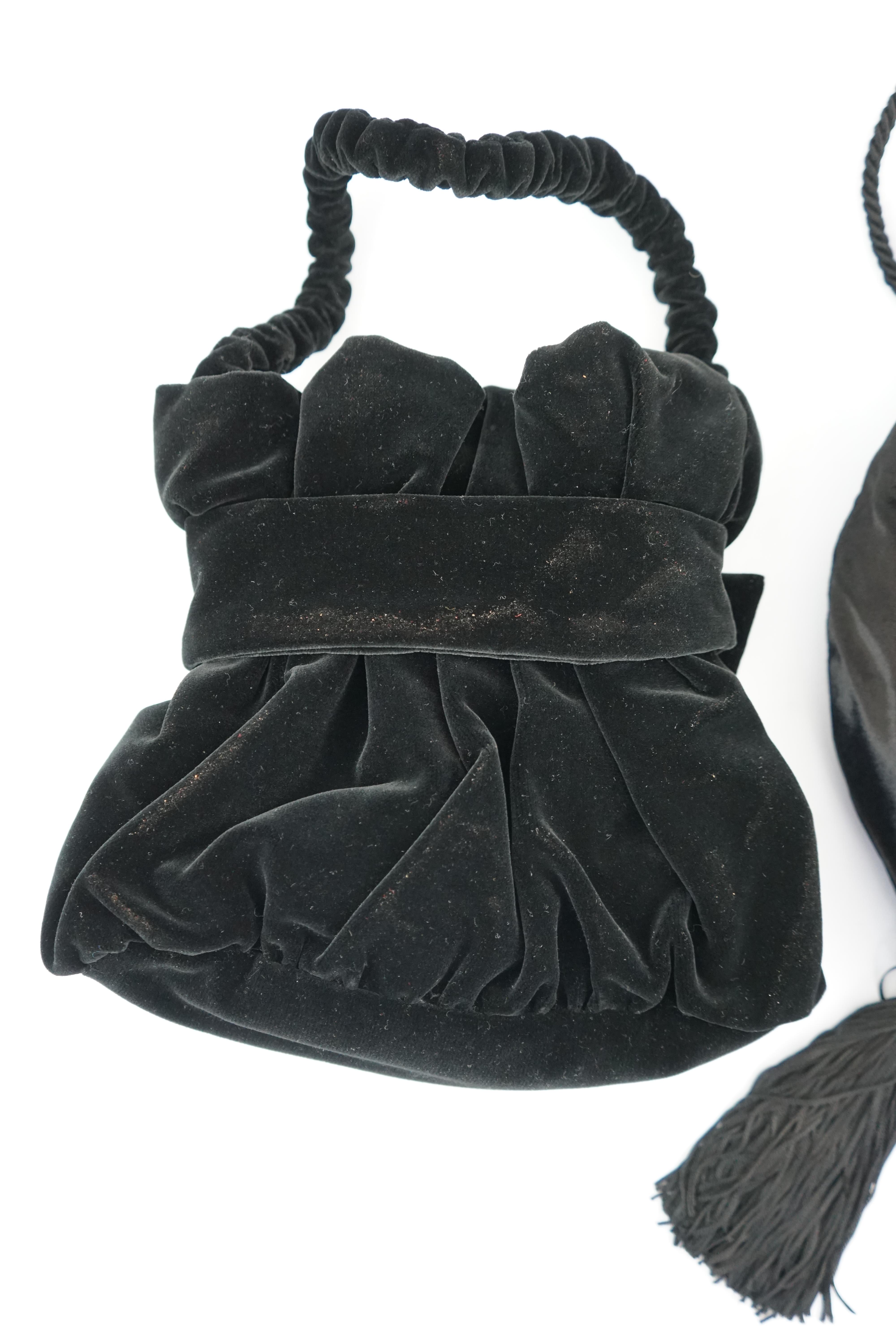 Two black velvet Italian evening bags, one labelled Rita Palmucci and the other Niro. One black silk velvet drawstring with blue satin lining, with tassel and diamanté decoration, the other black velvet with black satin